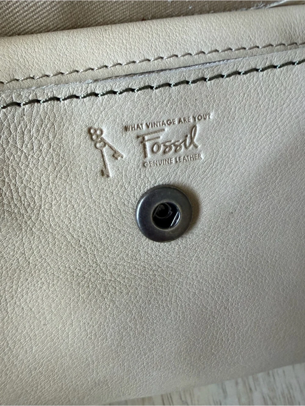 Fossil brand light Beige Patchwork Leather zip around Wallet with Button detail